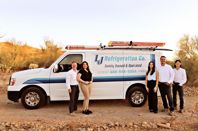 The LJ Refrigeration family team with their service van in the Sonoran Desert