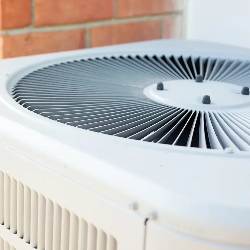 Outdoor condensing unit of the type used by both air conditioners and heat pumps